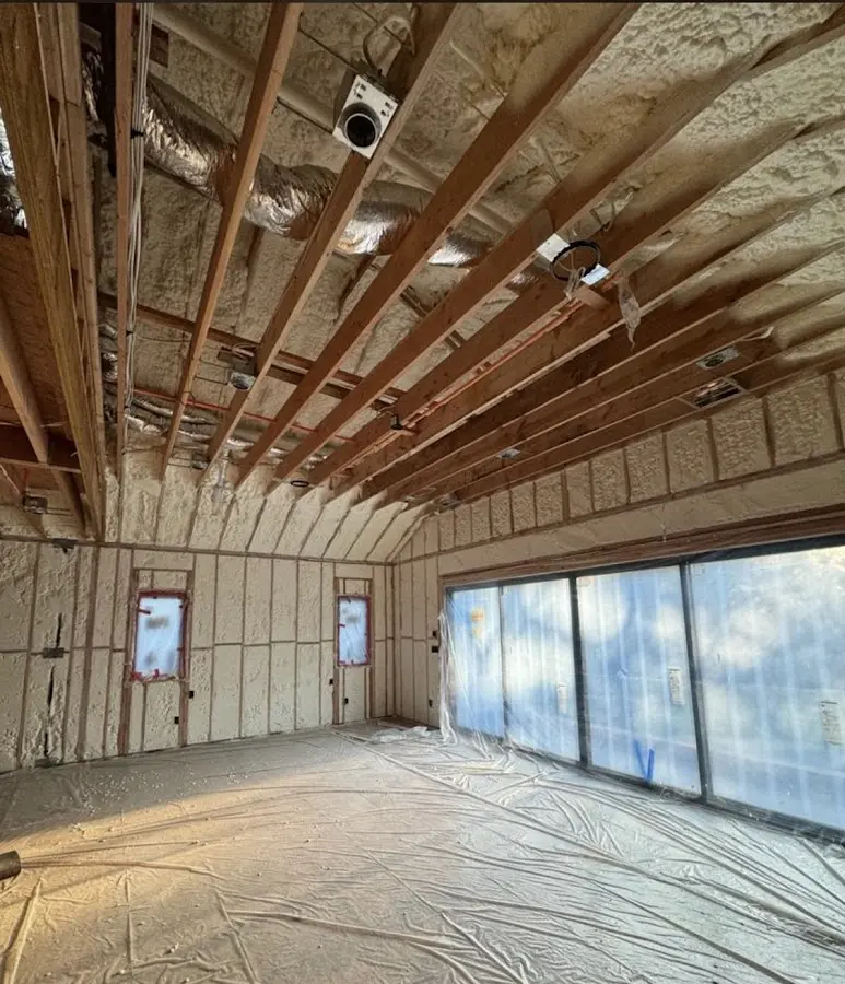 Interior walls and ceiling insulated with spray foam during new construction in North College Hill